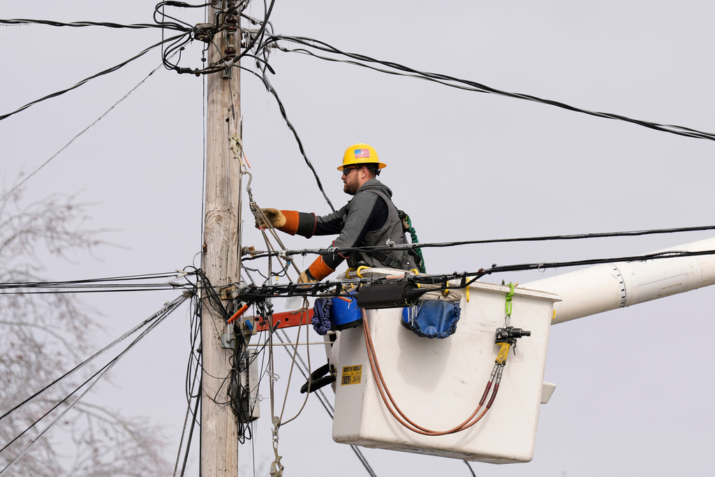 A linesman with the Nashville Electric Service works restore power Wednesday, Jan. 28, 2026, in Nashville, Tenn. after a winter storm passed through the area over the weekend. (AP Photo/George Walker IV)