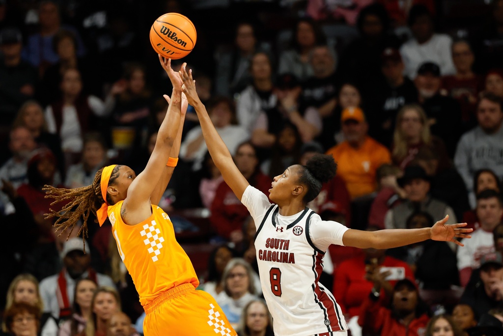Tennessee forward Janiah Barker, left, shoots against South Carolina forward Joyce Edwards (8) during the first half of an NCAA college basketball game in Columbia, S.C., Sunday, Feb. 8, 2026. (AP Photo/Nell Redmond)
