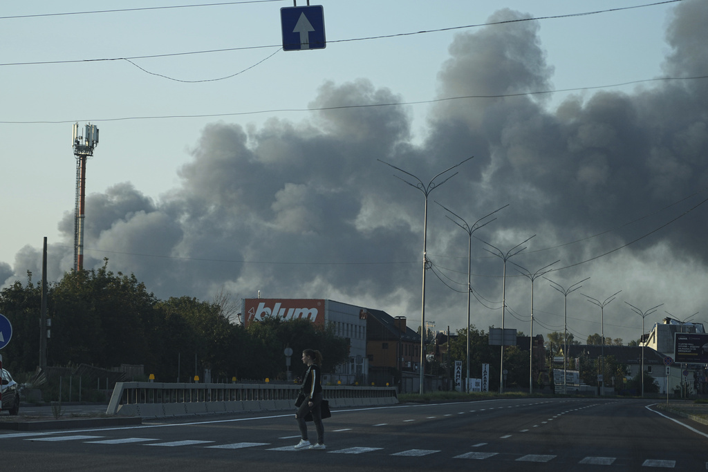 Smoke rises after a Russian attack in Kyiv, Ukraine, Sunday, Sept. 7, 2025. (AP Photo/Efrem Lukatsky)
