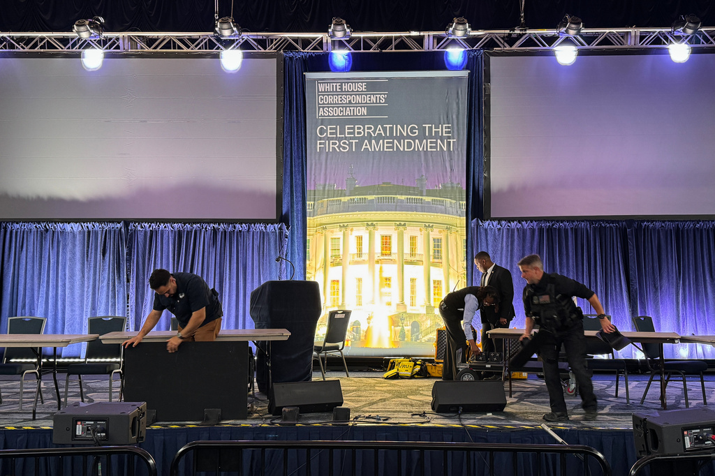 Staff clean up after a shooting incident at the White House Correspondents Dinner, Saturday, April 25, 2026, in Washington. (AP Photo/Mark Schiefelbein)