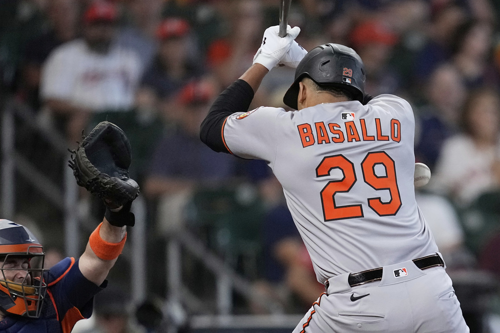 Baltimore Orioles' Samuel Basallo is hit by a pitch thrown by Houston Astros starting pitcher Cristian Javier during the second inning of a baseball game Sunday, Aug. 17, 2025, in Houston. (AP Photo/David J. Phillip)