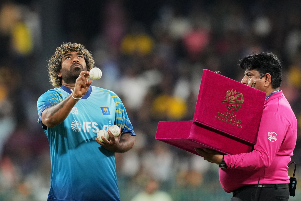 Sri Lanka's fast bowling coach Lasith Malinga checks balls before the start of the T20 World Cup cricket match between Sri Lanka and New Zealand in Colombo, Sri Lanka, Wednesday, Feb. 25, 2026. (AP Photo/Eranga Jayawardena)