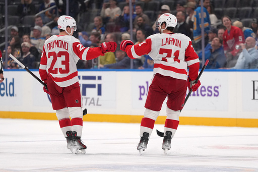 Detroit Red Wings' Dylan Larkin (71) is congratulated by Lucas Raymond (23) after scoring during the third period of an NHL hockey game against the St. Louis Blues Tuesday, Oct. 28, 2025, in St. Louis. (AP Photo/Jeff Roberson) Detroit Red Wings' Dylan Larkin (71) is congratulated by Lucas Raymond (23) after scoring during the third period of an NHL hockey game against the St. Louis Blues Tuesday, Oct. 28, 2025, in St. Louis. (AP Photo/Jeff Roberson)