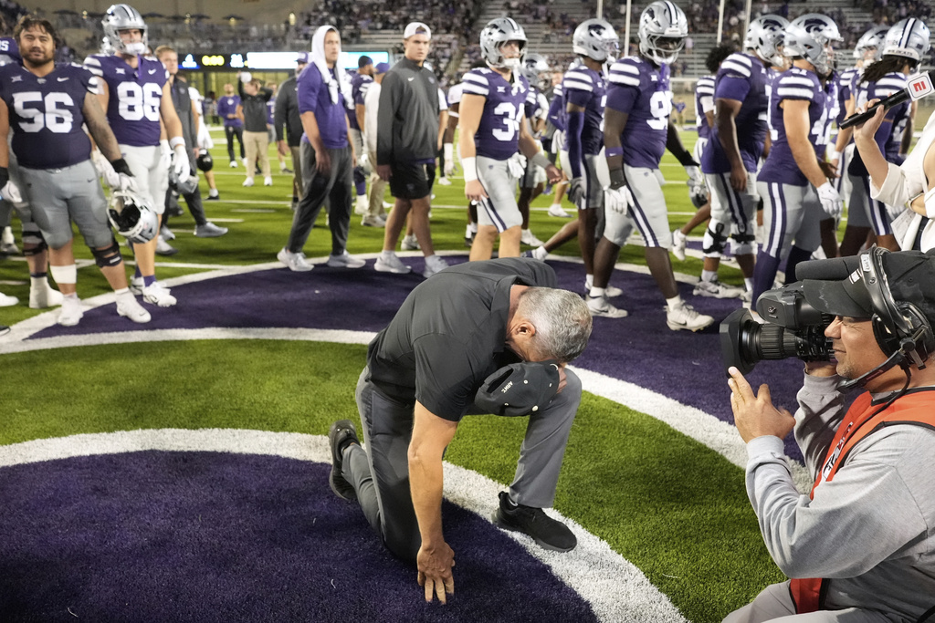 Army head coach Jeff Monken pauses on the field after beating Kansas State in an NCAA college football game Saturday, Sept. 6, 2025, in Manhattan, Kan. (AP Photo/Charlie Riedel)