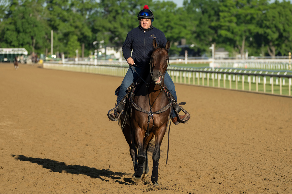 Cherie DeVaux, trainer of Kentucky Derby winner and Belmont Stakes entrant Golden Tempo, rides on a horse ahead of the 158th running of the Belmont Stakes horse race at Saratoga Race Course, Thursday, June 4, 2026, in Saratoga Springs, N.Y. (AP Photo/Yuki Iwamura)