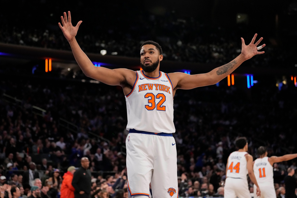 New York Knicks center Karl-Anthony Towns (32) reacts during the first half of an NBA basketball game against the Denver Nuggets, Wednesday, Feb. 4, 2026, in New York. (AP Photo/Yuki Iwamura)