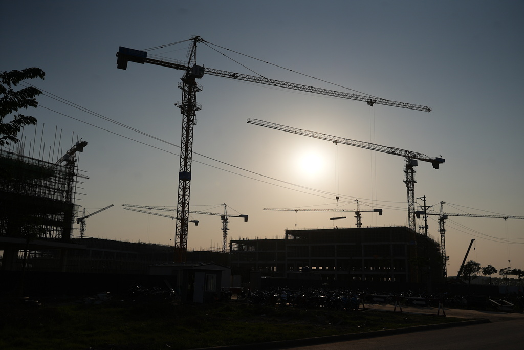 Multiple cranes are placed at a construction site at Yen Phong Industrial Park in Bac Ninh province, Vietnam, on Dec. 26, 2025. (AP Photo/Hau Dinh)