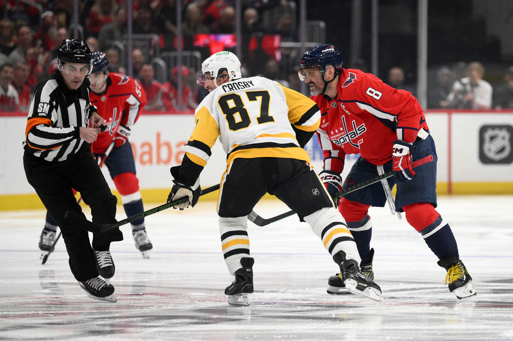 Washington Capitals left wing Alex Ovechkin (8) looks on after he faced off with Pittsburgh Penguins center Sidney Crosby (87) during the first period of an NHL hockey game, Sunday, April 12, 2026, in Washington. (AP Photo/Nick Wass)