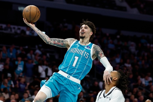 Charlotte Hornets guard LaMelo Ball (1) drives to the basket against Brooklyn Nets forward Ziaire Williams during the first half of an NBA basketball game in Charlotte, N.C., Wednesday, Oct. 22, 2025. (AP Photo/Nell Redmond) Charlotte Hornets guard LaMelo Ball (1) drives to the basket against Brooklyn Nets forward Ziaire Williams during the first half of an NBA basketball game in Charlotte, N.C., Wednesday, Oct. 22, 2025. (AP Photo/Nell Redmond)