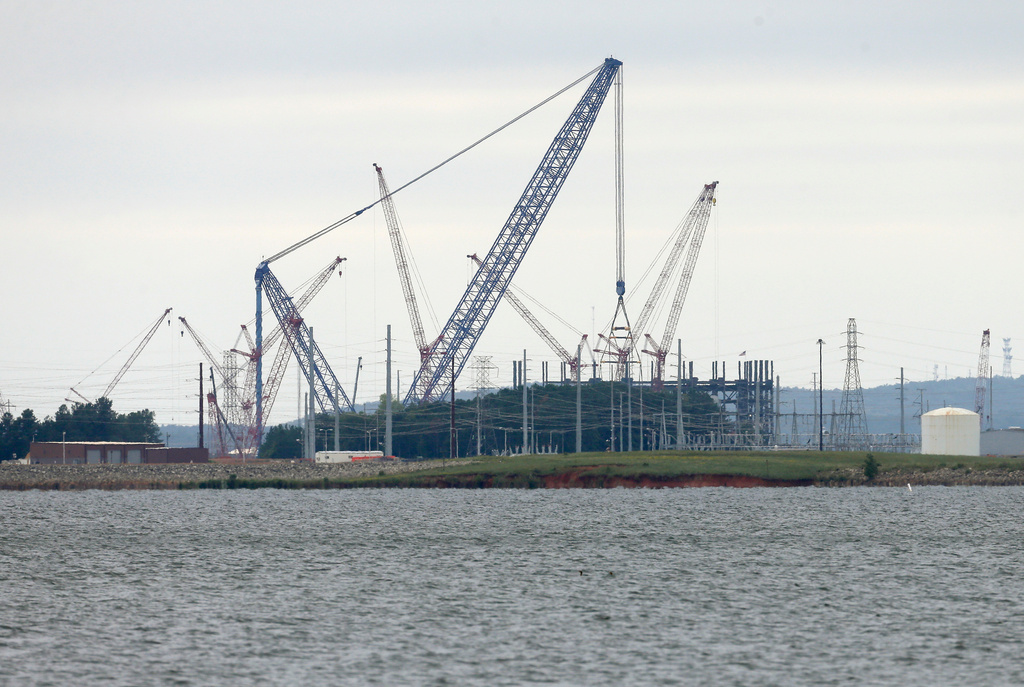 FILE - V.C. Summer Nuclear Station's unit two is shown under construction near Jenkinsville, S.C., during a media tour of the facility Wednesday, Sept. 21, 2016. (AP Photo/Chuck Burton)