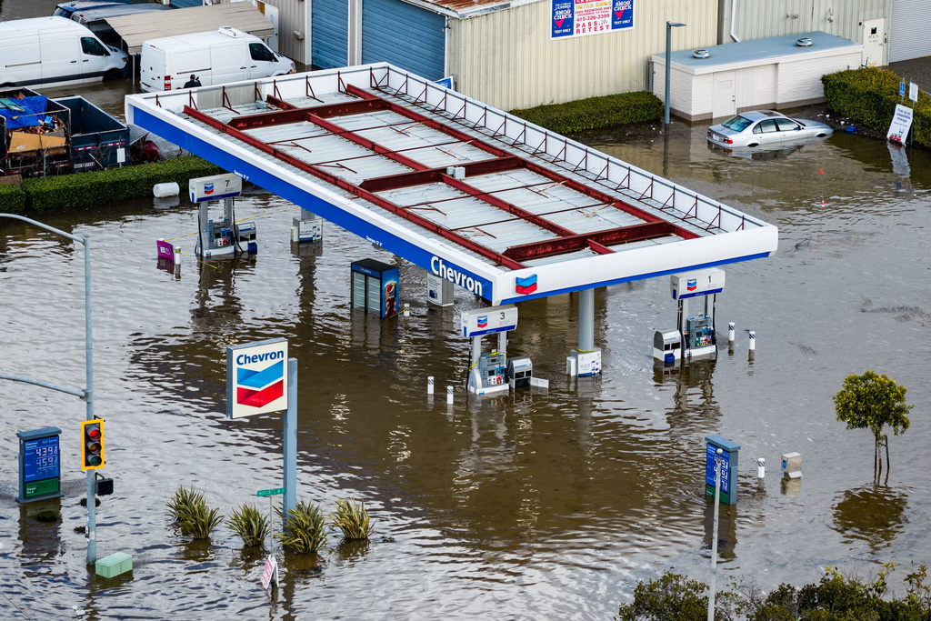 Streets are flooded by the "King Tides", occurring when the sun, moon and Earth align, causing a stronger gravitational pull Saturday, Jan. 3, 2026, near Corte Madera in Marin County, Calif. (AP Photo/Ethan Swope)