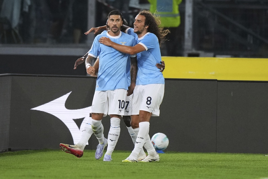 Lazio's Mattia Zaccagni, left, celebrates with his teammates after he scored his side's second goal during a Serie A soccer match between Lazio and Hellas Verona, at Rome's Olympic Stadium, Sunday, Aug. 31, 2025. (AP Photo/Andrew Medichini)