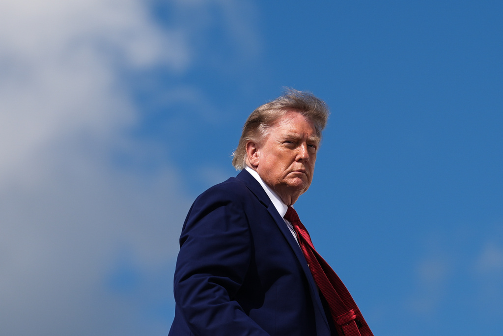 President Donald Trump boards Air Force One, Friday, Aug. 7, 2026, at Joint Base Andrews, Md. (AP Photo/Julia Demaree Nikhinson)