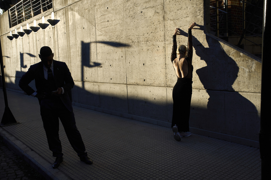 Ana Gomez, from Colombia, stretches as she prepares to compete in the World Tango Championship semifinals in Buenos Aires, Argentina, Friday, July 29, 2025. (AP Photo/Rodrigo Abd)