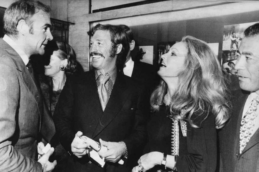 FILE - From left, Sean Connery, Jean-Paul Belmondo, Ursula Andress and Toshiro Mifune are seen in Paris, around Sept. 17, 1971. (AP Photo/Jean-Jacques Levy, File)