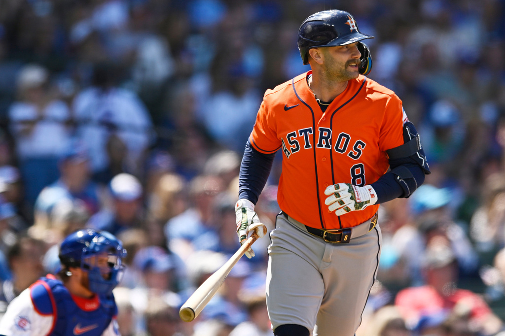 Houston Astros' Christian Walker (8) watches his three-run home run during the fifth inning of a baseball game against the Chicago Cubs in Chicago, Sunday, May 24, 2026. (AP Photo/Paul Beaty)