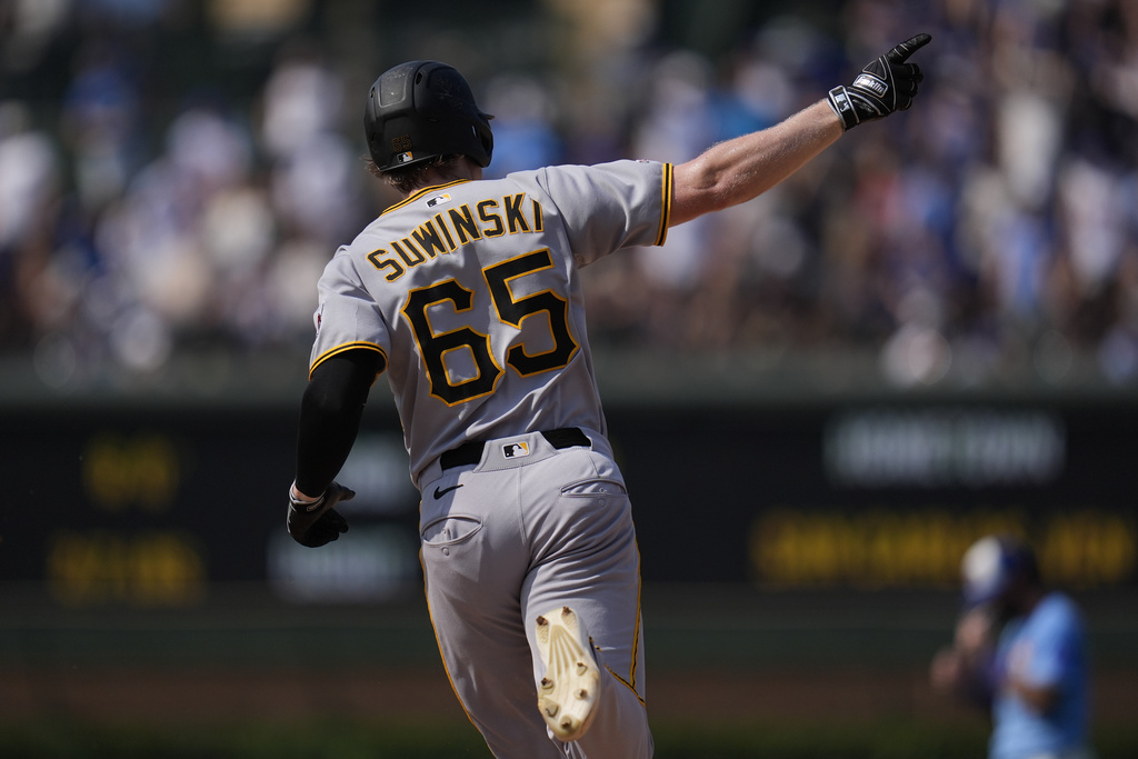 Pittsburgh Pirates' Jack Suwinski (65) runs the bases after hitting a home run during the ninth inning of a baseball game against the Chicago Cubs, Friday, Aug. 15, 2025, in Chicago. (AP Photo/Erin Hooley)