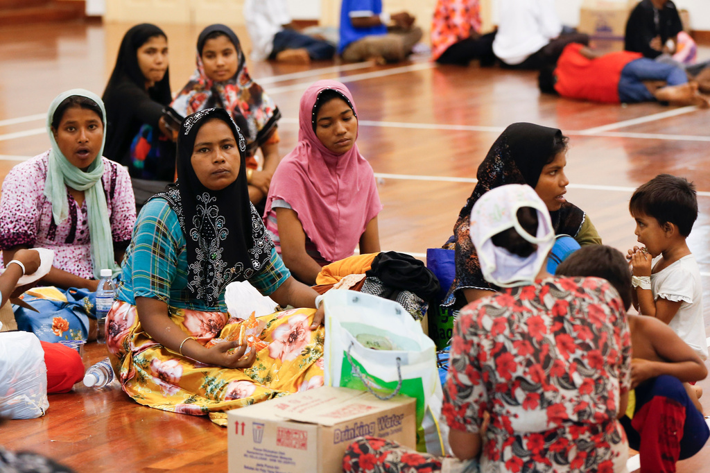 FILE - Illegal immigrants from Myanmar rest at a temporary immigration detention center in Langkawi, Malaysia on May 12, 2015. (AP Photo/Vincent Thian)