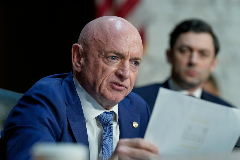 Sen. Mark Kelly, D-Ariz., asks a question during the Senate Committee on Intelligence hearings to examine worldwide threats on Capitol Hill Wednesday, March 18, 2026, in Washington. (AP Photo/Jose Luis Magana)