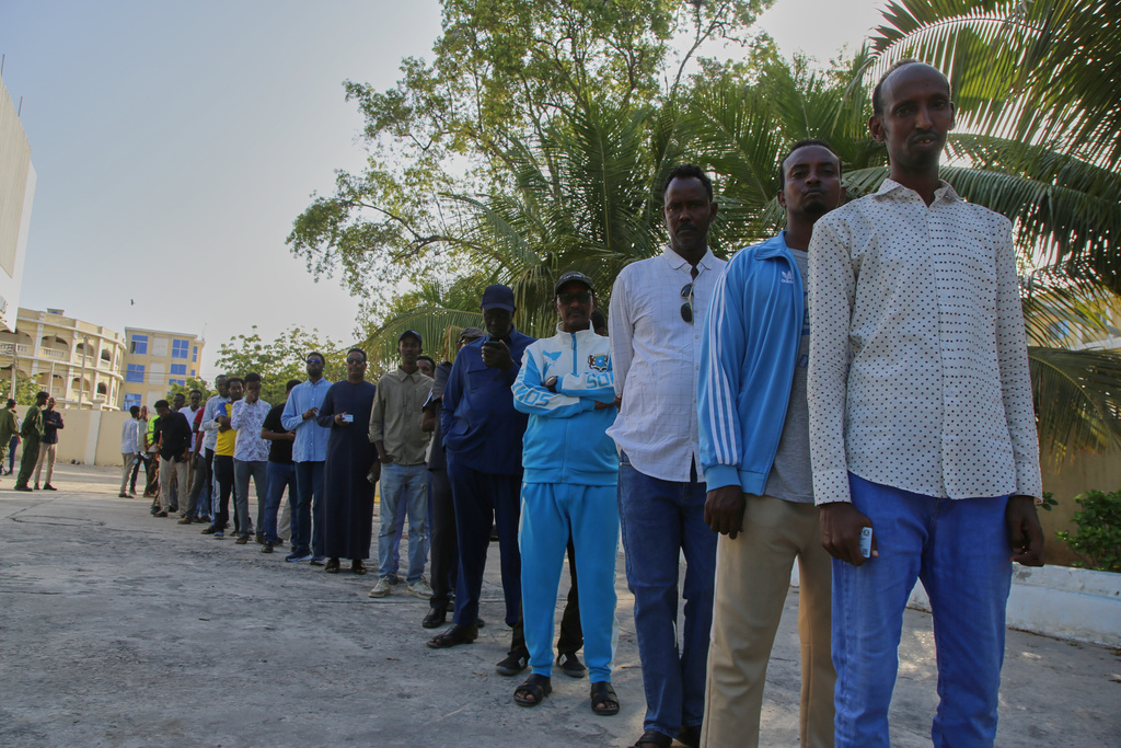 People queue to cast their votes during the local election in Mogadishu, Somalia, Thursday, Dec. 25, 2025. (AP Photo/Farah Abdi Warsameh)