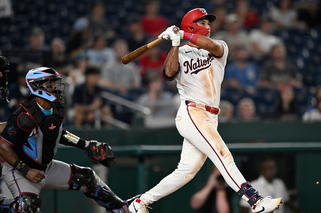 Washington Nationals' Daylen Lile watches his two run home run go over the right field fence during the seventh inning of a baseball game against the Miami Marlins, Monday, Aug. 31, 2026, in Washington. (AP Photo/John McDonnell)