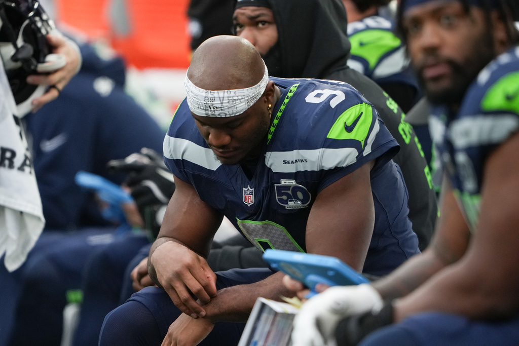 Seattle Seahawks running back Kenneth Walker III reacts on the sideline during the second half of an NFL football game against the Indianapolis Colts, Sunday, Dec. 14, 2025, in Seattle. (AP Photo/Lindsey Wasson)