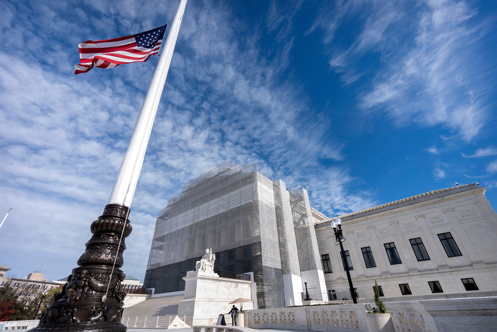 An American flag flies at half-staff outside the Supreme Court on Wednesday, Nov. 5, 2025, in Washington. (AP Photo/Mark Schiefelbein)