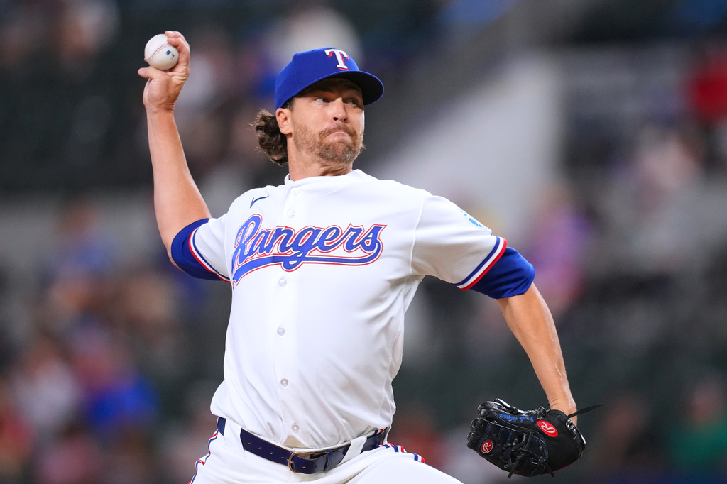 Texas Rangers pitcher Jacob deGrom throws to the Athletics during the first inning of a baseball game Monday, Aug. 31, 2026, in Arlington, Texas. (AP Photo/Julio Cortez)