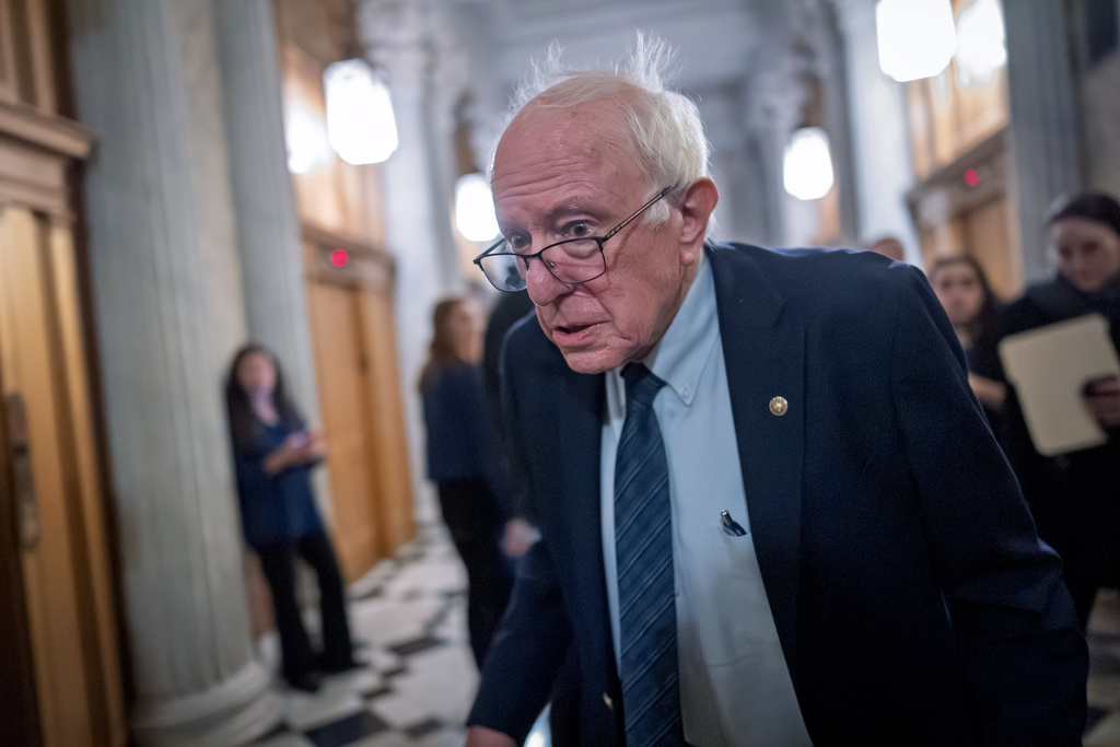 Sen. Bernie Sanders, I-Vt., heads to the chamber as the Senate votes to bring the longest government shutdown in U.S. history to an end after a bipartisan compromise, at the Capitol in Washington, Monday, Nov. 10, 2025. (AP Photo/J. Scott Applewhite)