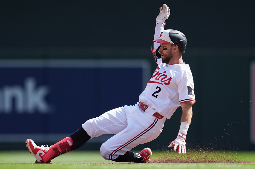 Minnesota Twins' Kody Clemens (2) slides into second base safely after hitting a single and advancing on a fielding error by New York Yankees center fielder Spencer Jones during the fourth inning of a baseball game, Wednesday, Sept. 16, 2026, in Minneapolis. (AP Photo/Abbie Parr)