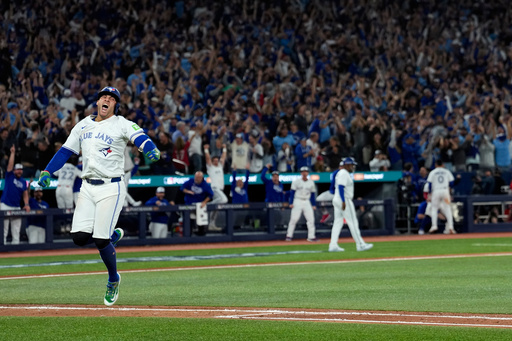 Toronto Blue Jays' George Springer reacts after hitting a three run home run against the Seattle Mariners during the seventh inning in Game 7 of baseball's American League Championship Series, Monday, Oct. 20, 2025, in Toronto. (AP Photo/David J. Phillip) Toronto Blue Jays' George Springer reacts after hitting a three run home run against the Seattle Mariners during the seventh inning in Game 7 of baseball's American League Championship Series, Monday, Oct. 20, 2025, in Toronto. (AP Photo/David J. Phillip)