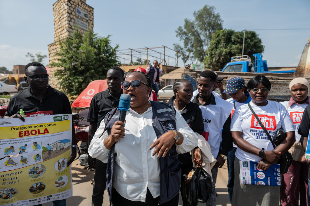 Jolie Milete, a staff member of the World Health Organization (WHO), addresses a crowd during an awareness campaign to combat Ebola in Bunia, Congo, Wednesday, June 10, 2026. (AP Photo/Moses Sawasawa)
