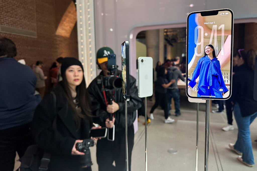 The new iPhone 17e sits on display during an Apple unveil event, Wednesday, March 4, 2026, in New York. (AP Photo/Ted Shaffrey) ,