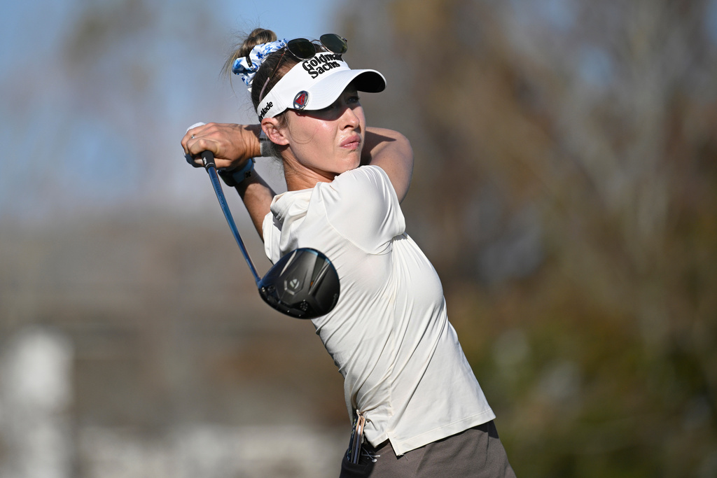 Nelly Korda tees off on the 18th hole during the final round of the PNC Championship golf tournament, Sunday, Dec. 21, 2025, in Orlando, Fla. (AP Photo/Phelan M. Ebenhack)