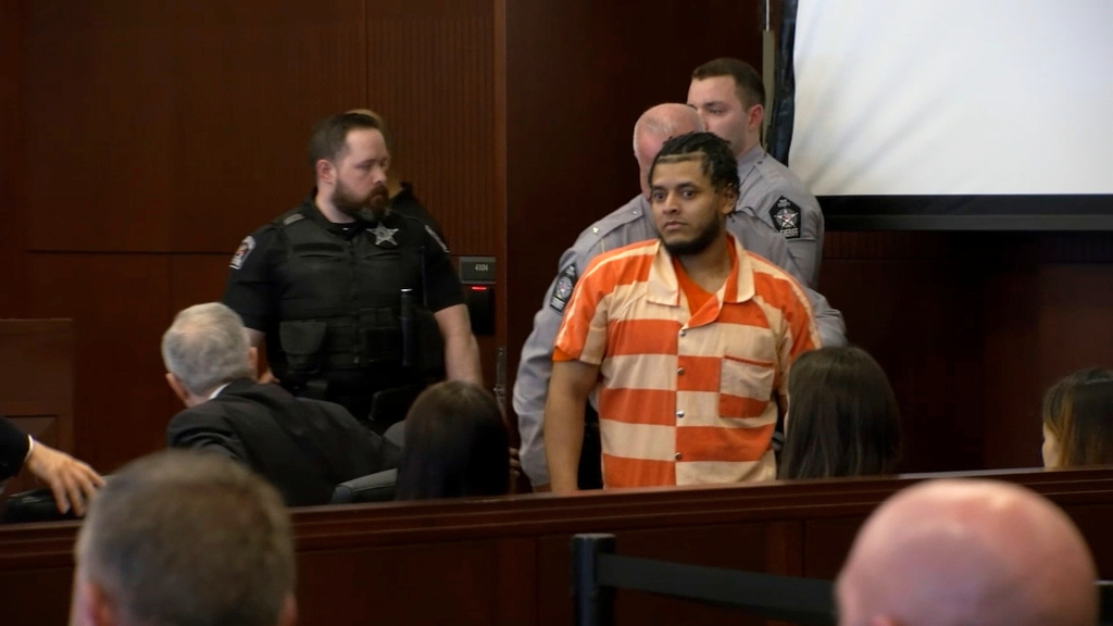 In this image taken from video provided by WTVD-TV, Alder Marin-Sotelo, center, walks into a hearing on charges related to the killing of a North Carolina sheriff's deputy in 2022, Tuesday, Sept. 16, 2025, in Raleigh, N.C. (AP Photo/WTVD-TV)