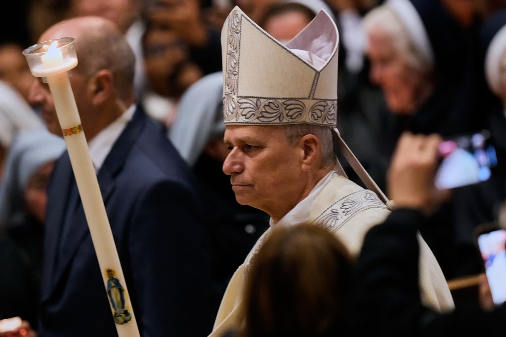 Pope Leo XIV arrives to preside over Mass in St. Peter's Basilica at the Vatican on the Cathilic feast of the Presentation of the Lord, Monday, Feb. 2, 2026. (AP Photo/Gregorio Borgia)