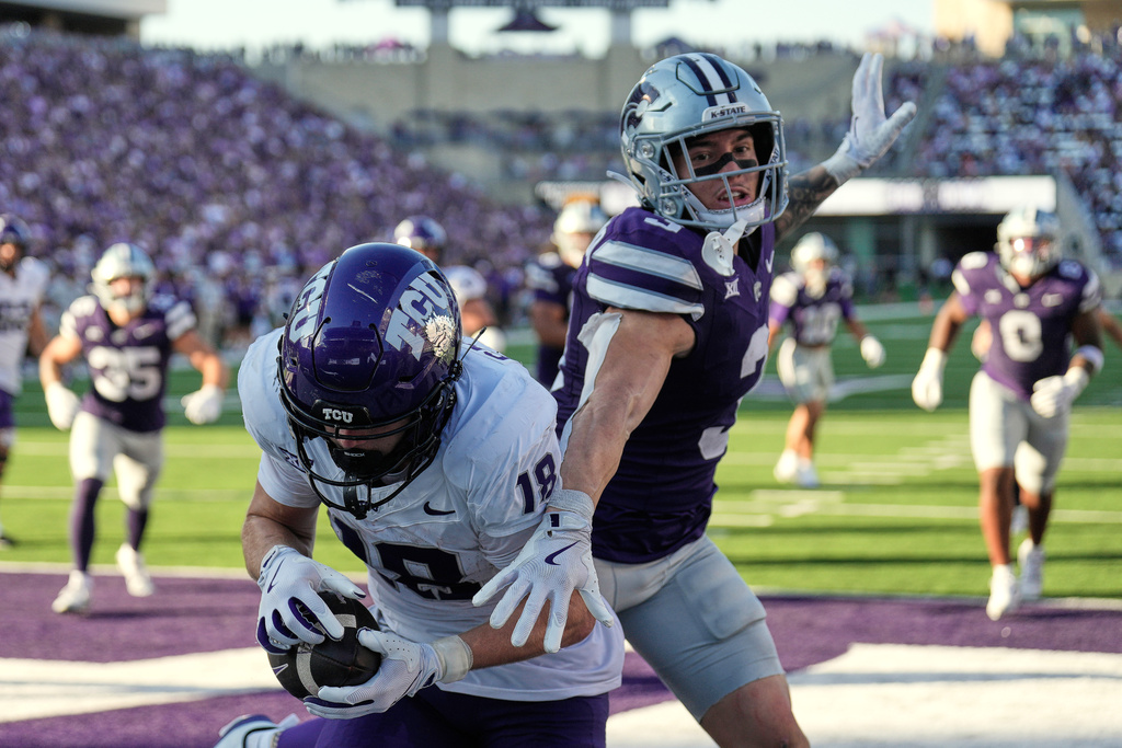 Kansas State safety Gunner Maldonado (3) breaks up a pass intended for TCU wide receiver Ed Small (18) during the second half of an NCAA college football game Saturday, Oct. 11, 2025, in Manhattan, Kan. (AP Photo/Charlie Riedel)