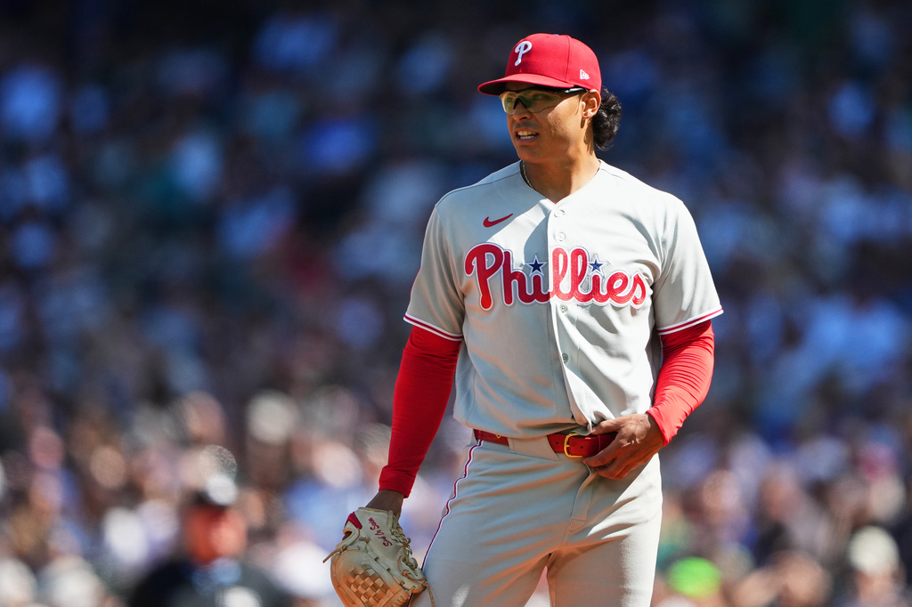 Philadelphia Phillies starting pitcher Jesús Luzardo reacts after giving up a single to Seattle Mariners' Jhonny Pereda during the fifth inning of a baseball game, Wednesday, Aug. 26, 2026, in Seattle. (AP Photo/Lindsey Wasson)