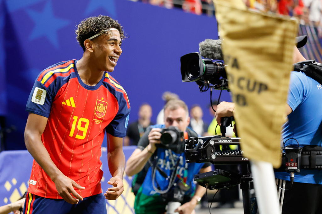 Spain's Lamine Yamal celebrates with teammate Rodri, left, after scoring his side's opening goal during the World Cup Group H soccer match between Spain and Saudi Arabia in Atlanta, Sunday, June 21, 2026. (AP Photo/Erik S.Lesser)
