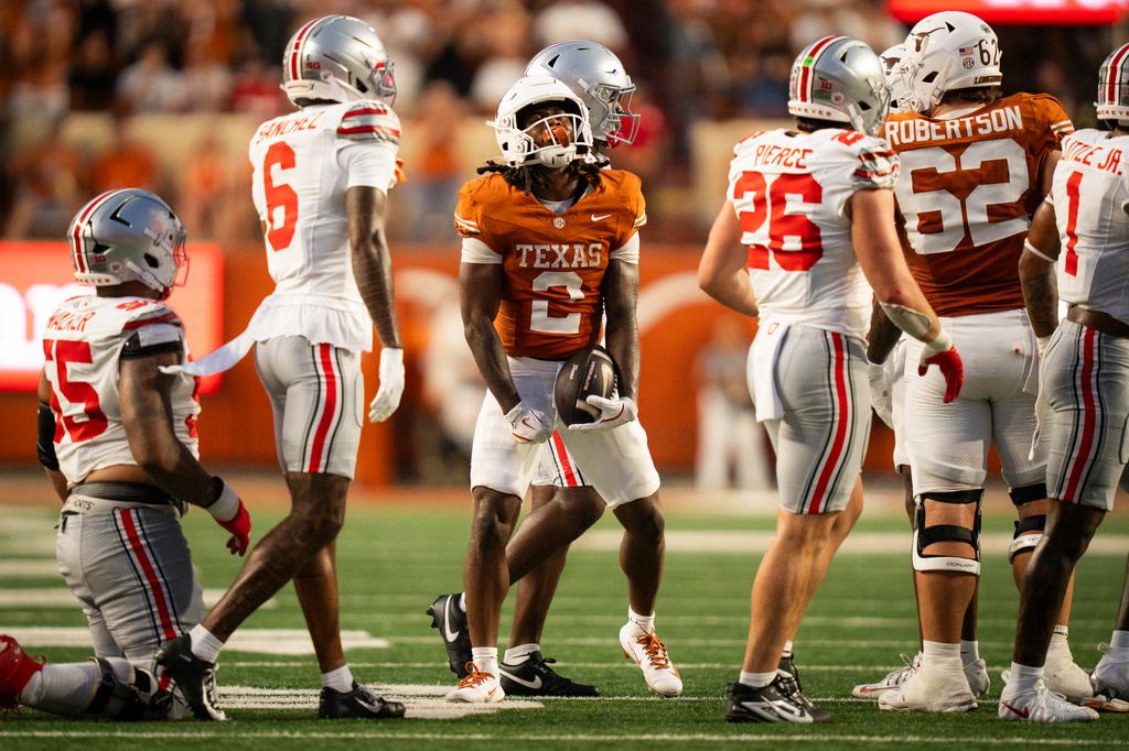 Texas Longhorns running back Hollywood Smothers (2) celebrates a first down against Ohio State in the second quarter of an NCAA college football game in Austin, Texas, Saturday, Sept. 12, 2026. (Sara Diggins/The San Antonio Express-News via AP)