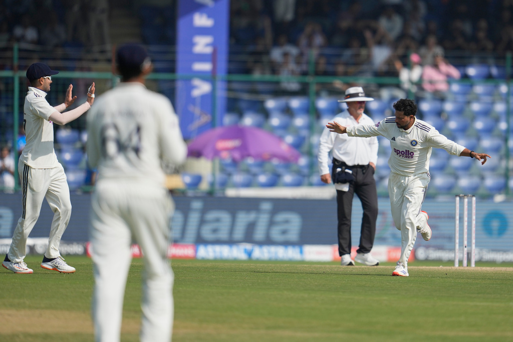 India's Kuldeep Yadav celebrates the dismissal of West Indies' Shai Hope on the third day of the second cricket test match between India and West Indies at the Arun Jaitley Stadium in New Delhi, India, Sunday, Oct.12, 2025. (AP Photo/Manish Swarup)