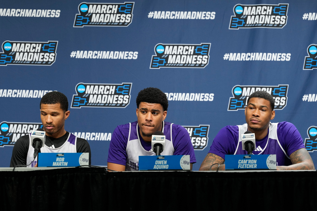 From left to right, High Point guard Rob Martin, forward Owen Aquino and forward Cam'ron Fletcher listen during a news conference prior to the second round of the NCAA college basketball tournament Friday, March 20, 2026, in Portland, Ore. (AP Photo/Jenny Kane)
