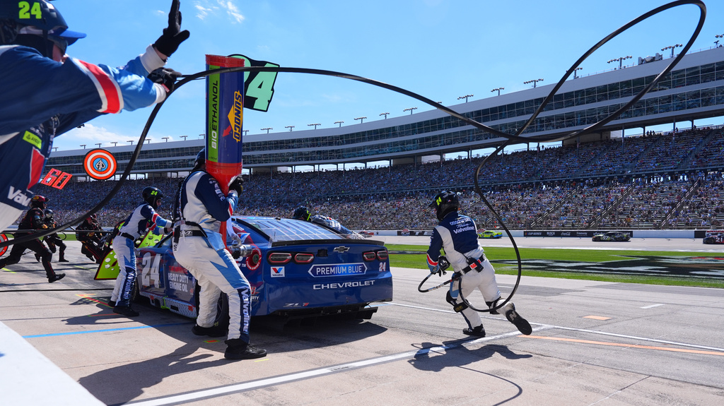 The pit crew for driver William Byron (24) gets to work during a NASCAR Cup Series auto race in Fort Worth, Texas, Sunday, May 3, 2026. (AP Photo/LM Otero)