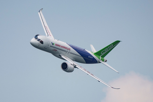 FILE - A COMAC C919 aircraft flies during the first day of the Singapore Airshow in Singapore, Feb. 20, 2024. (AP Photo/Vincent Thian, File) FILE - A COMAC C919 aircraft flies during the first day of the Singapore Airshow in Singapore, Feb. 20, 2024. (AP Photo/Vincent Thian, File)