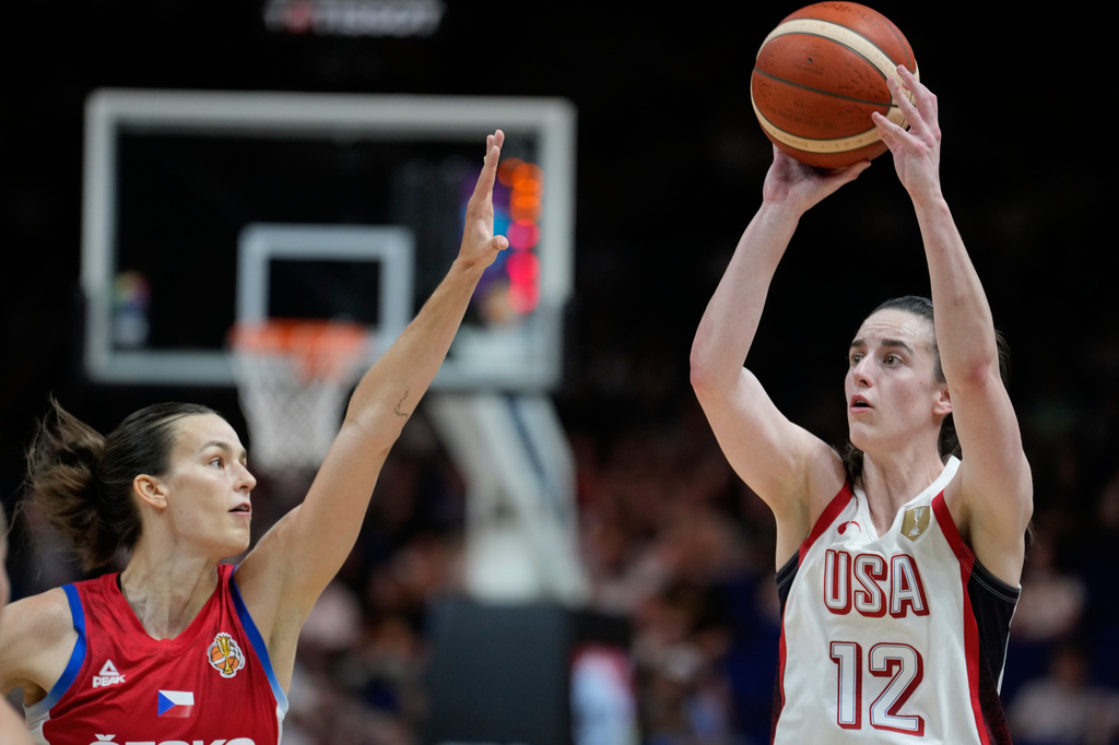 Caitlin Clark, of the United States, shoots over Czechia's Veronika Vorackova during the Women's Basketball World Cup match between the United States and Czechia in Berlin, Monday, Sept. 7, 2026. (AP Photo/Ebrahim Noroozi)