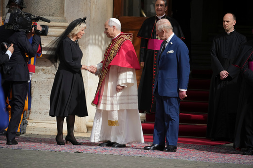 Pope Leo XIV, center, cheers with Queen Camilla and Britain's King Charles III in the St. Damasus Courtyard at the Vatican after a state visit and pray with him in the Sistine Chapel, Thursday, Oct. 23, 2025. (AP Photo/Andrew Medichini) Pope Leo XIV, center, cheers with Queen Camilla and Britain's King Charles III in the St. Damasus Courtyard at the Vatican after a state visit and pray with him in the Sistine Chapel, Thursday, Oct. 23, 2025. (AP Photo/Andrew Medichini)