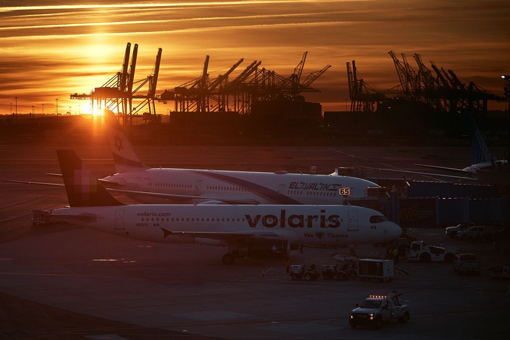 Planes are seen at Newark Liberty International Airport on Friday, Nov. 7, 2025, in Newark, N.J. (AP Photo/Andres Kudacki)