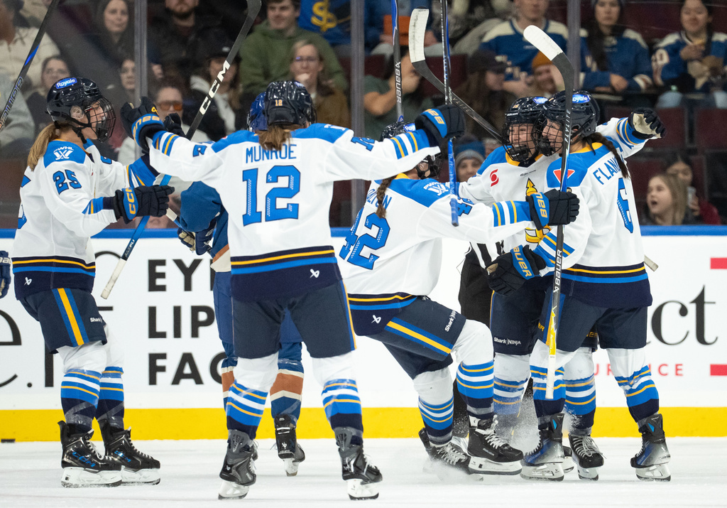 Toronto Sceptres' Lauren Messier (16) celebrates her goal against the Vancouver Goldeneyes with teammates Kali Flanagan (6), Claire Dalton (42), Allie Munroe (12) and Clara van Wieren (25) during the first period of an PWHL hockey game in Vancouver, Sunday, March 1, 2026. (Ethan Cairns/The Canadian Press via AP)