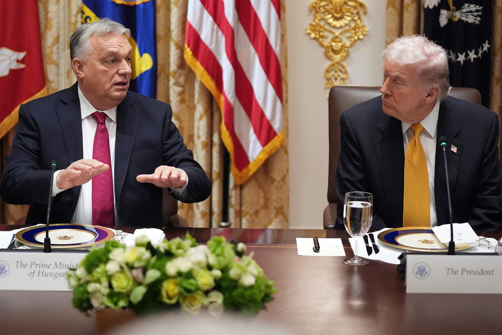 Hungary's Prime Minister Viktor Orban speaks during a meeting with President Donald Trump, right, in the Cabinet Room of the White House, Friday, Nov. 7, 2025, in Washington. (AP Photo/Evan Vucci)