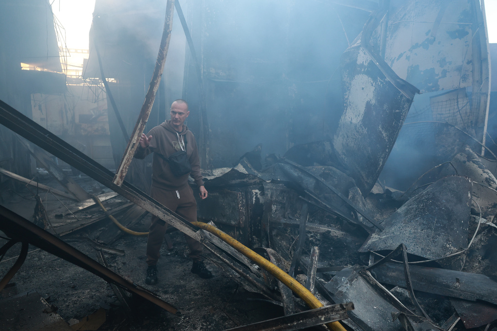 A man walks at the central market damaged in a Russian strike on Zaporizhzhia, Ukraine, on Saturday, Sept.26, 2026. (AP Photo/Kateryna Klochko)